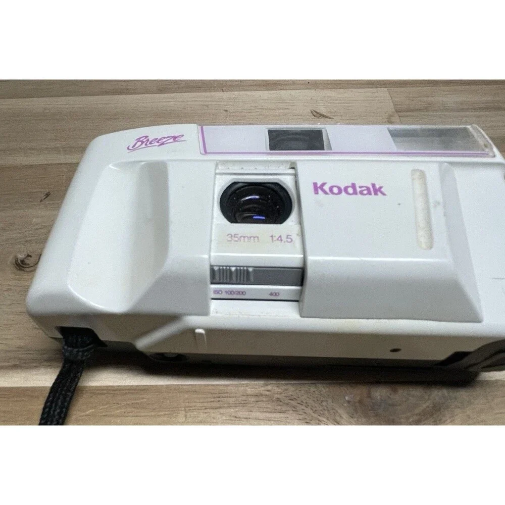 Kodak White Breeze Point-and-Shoot Camera with Black Strap and Pink Accents